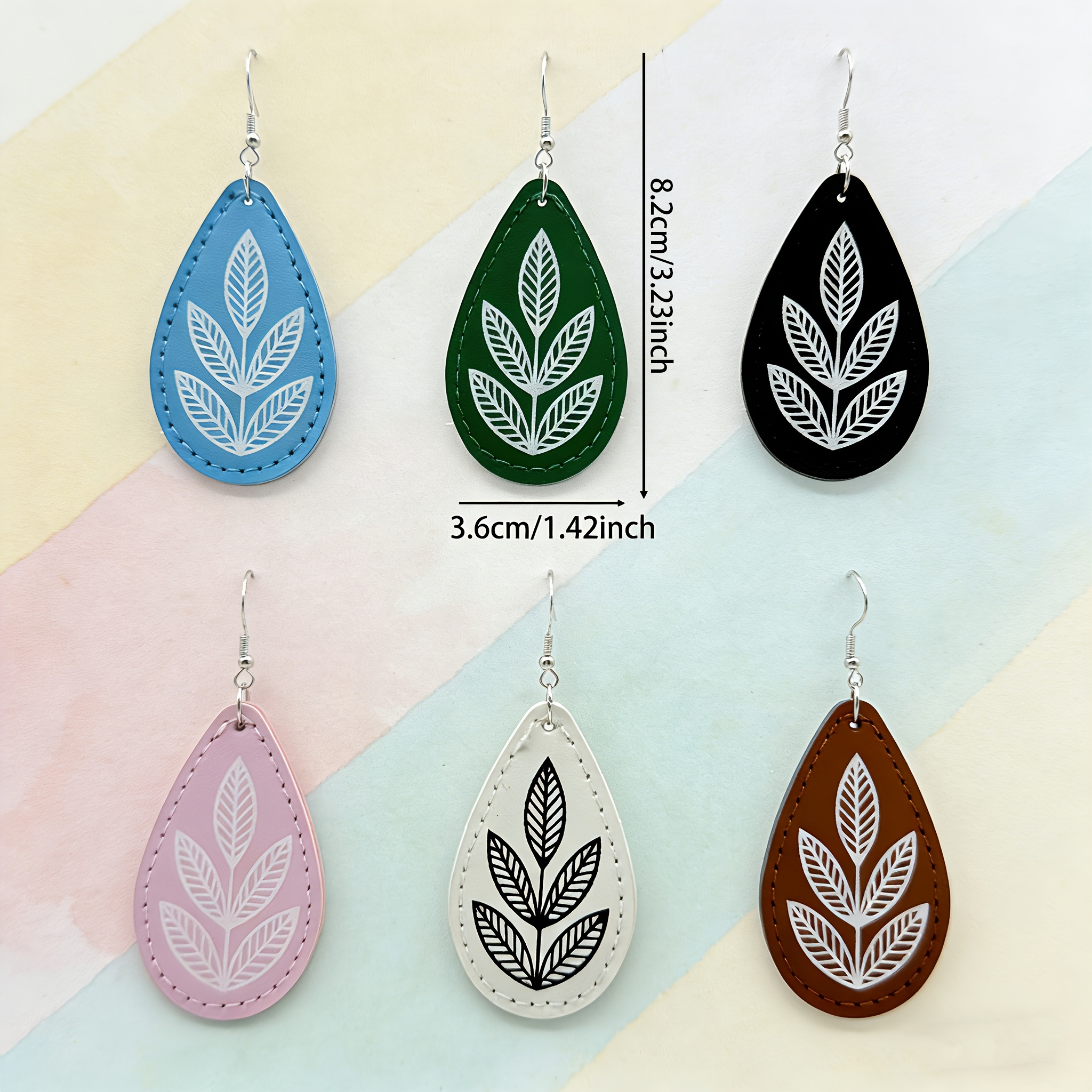 A Pair of Elegant Bohemian-Style Faux Leather Teardrop Earrings for Fashionable Women - Featuring a Thickened Stitching Process, Lightweight Drop Earrings with a Stylish Leaf Pattern, And Unique Plant Print Additions