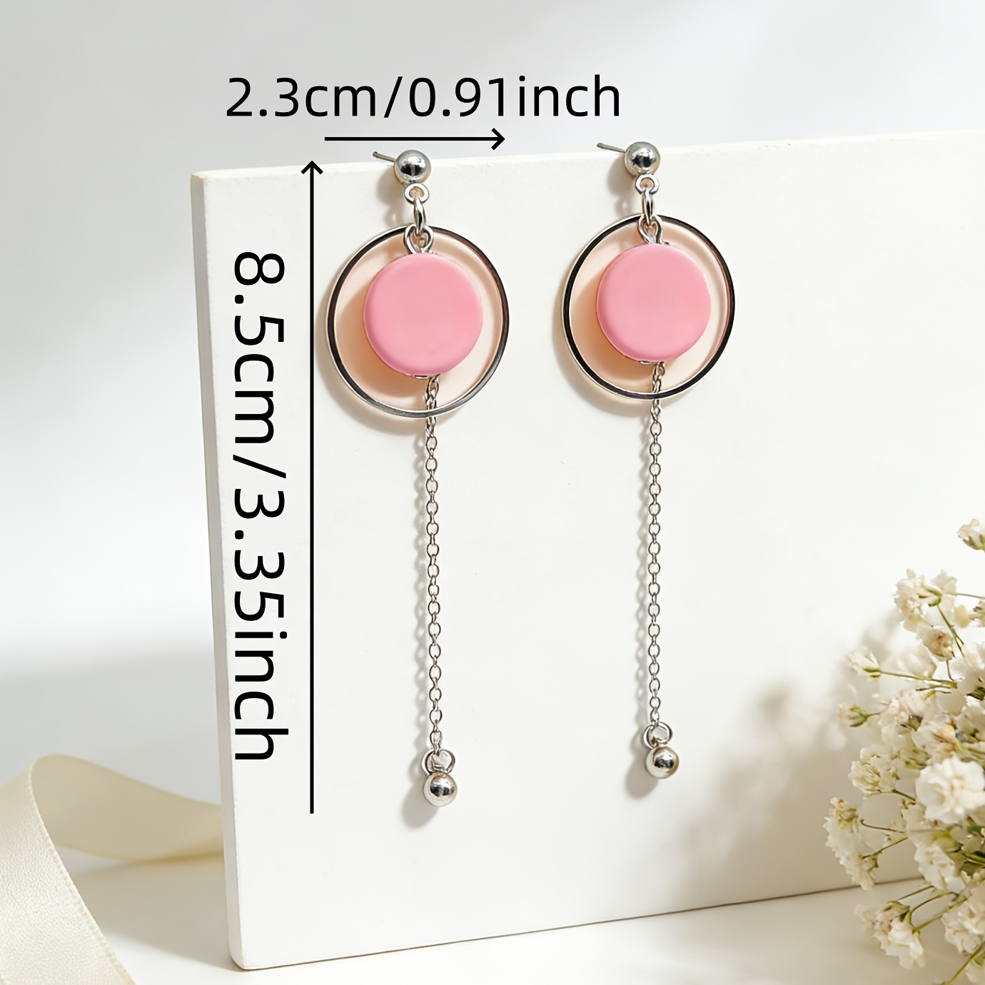 A Pair of Pink Tassel Drop Earrings with Chain Pendants, Featuring a Trendy And Unique Design with Contrasting Colors And Circular Rings, Suitable for Everyday Wear, Vacations, And Minimalist Outfits